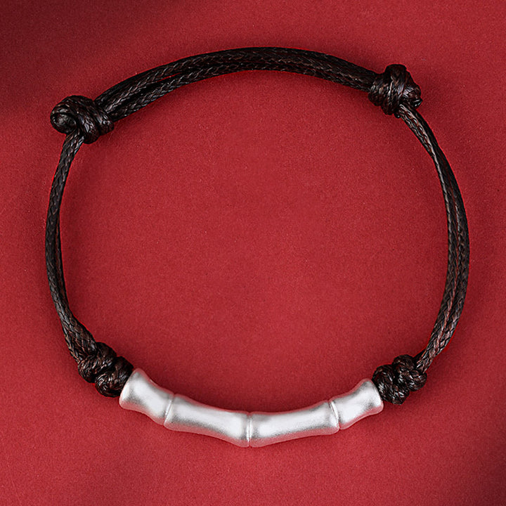 Braccialetto intrecciato con corda portafortuna a motivo osseo in argento sterling 999 Buddha Stones