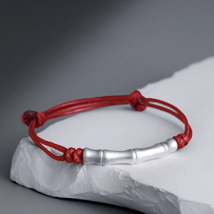 Braccialetto intrecciato con corda portafortuna a motivo osseo in argento sterling 999 Buddha Stones
