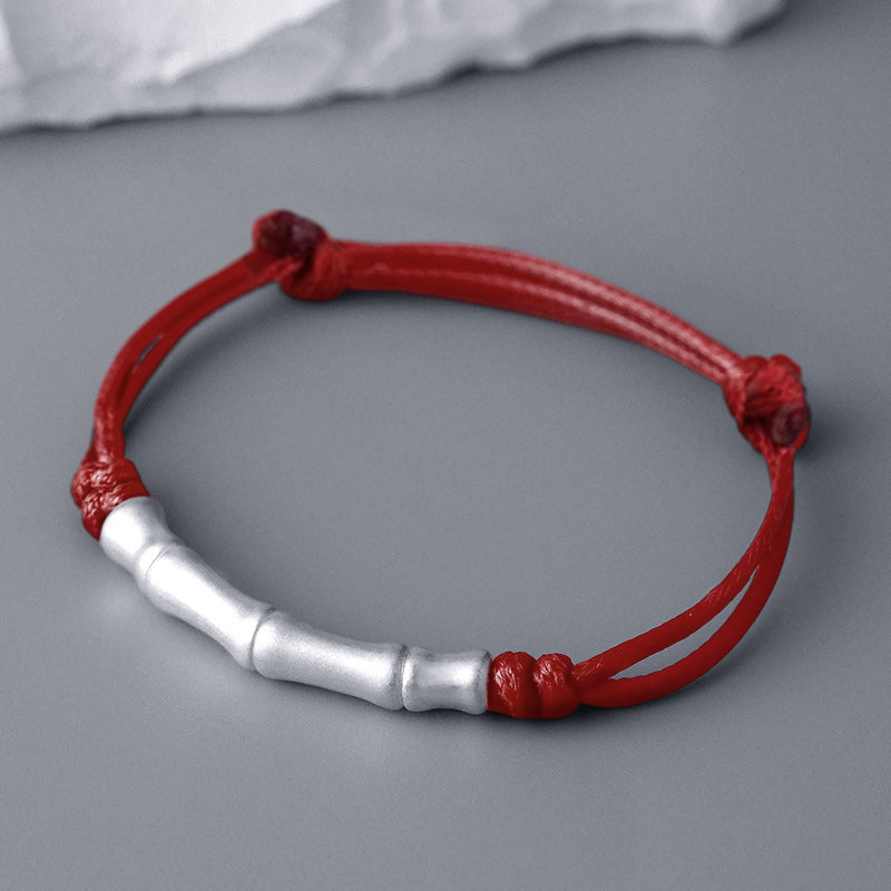 Braccialetto intrecciato con corda portafortuna a motivo osseo in argento sterling 999 Buddha Stones