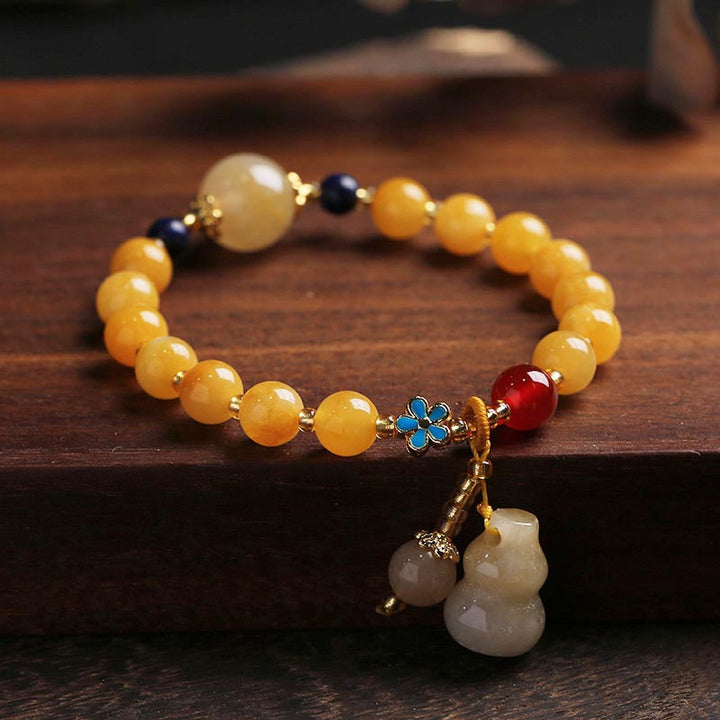 Braccialetto di fortuna e ricchezza con ciondolo di zucca in giada di seta dorata naturale Buddha Stones