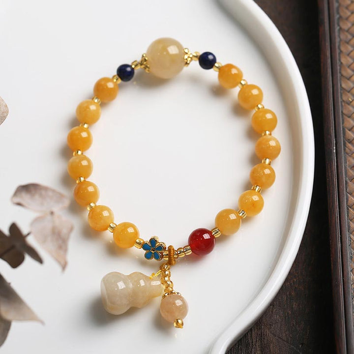 Braccialetto di fortuna e ricchezza con ciondolo di zucca in giada di seta dorata naturale Buddha Stones