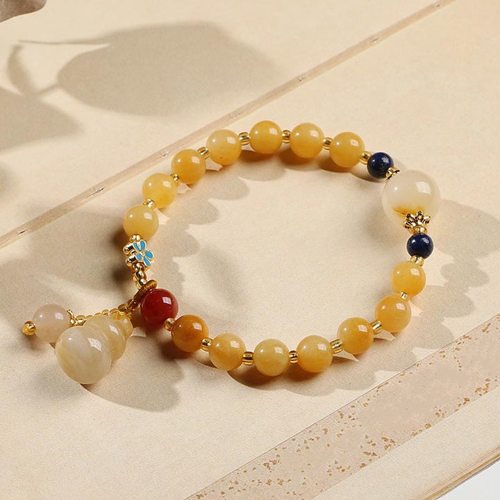 Braccialetto di fortuna e ricchezza con ciondolo di zucca in giada di seta dorata naturale Buddha Stones