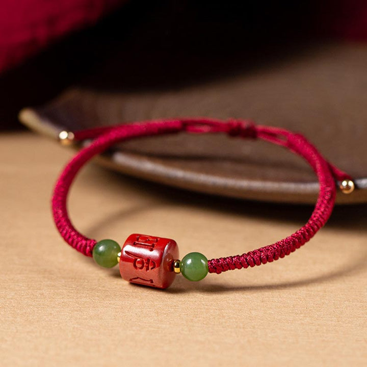 Buddha Stones Tibetam Cinnabar Om Mani Padme Hum Braccialetto di corda intrecciata con incisione di benedizione