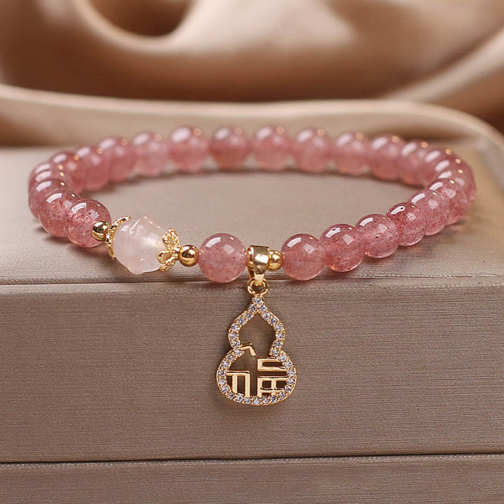 Braccialetto positivo con ciondolo a forma di carattere Fu di zucca e quarzo fragola Buddha Stones
