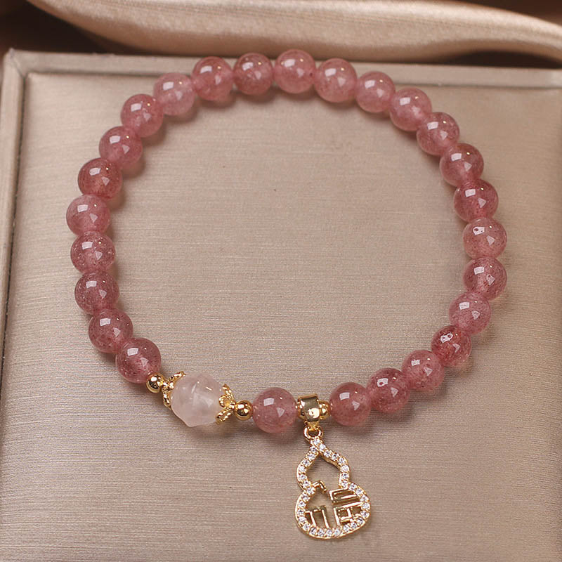 Braccialetto positivo con ciondolo a forma di carattere Fu di zucca e quarzo fragola Buddha Stones