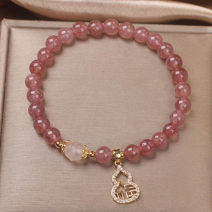 Braccialetto positivo con ciondolo a forma di carattere Fu di zucca e quarzo fragola Buddha Stones