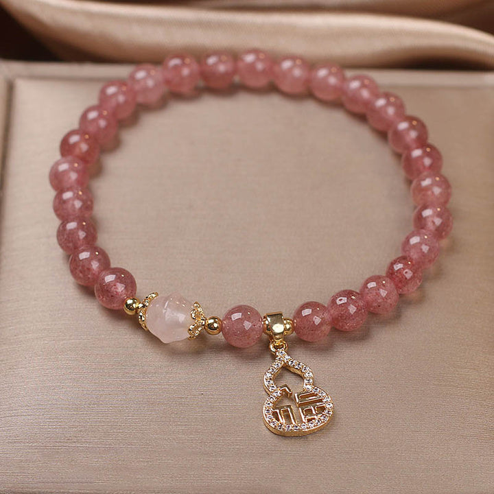 Braccialetto positivo con ciondolo a forma di carattere Fu di zucca e quarzo fragola Buddha Stones