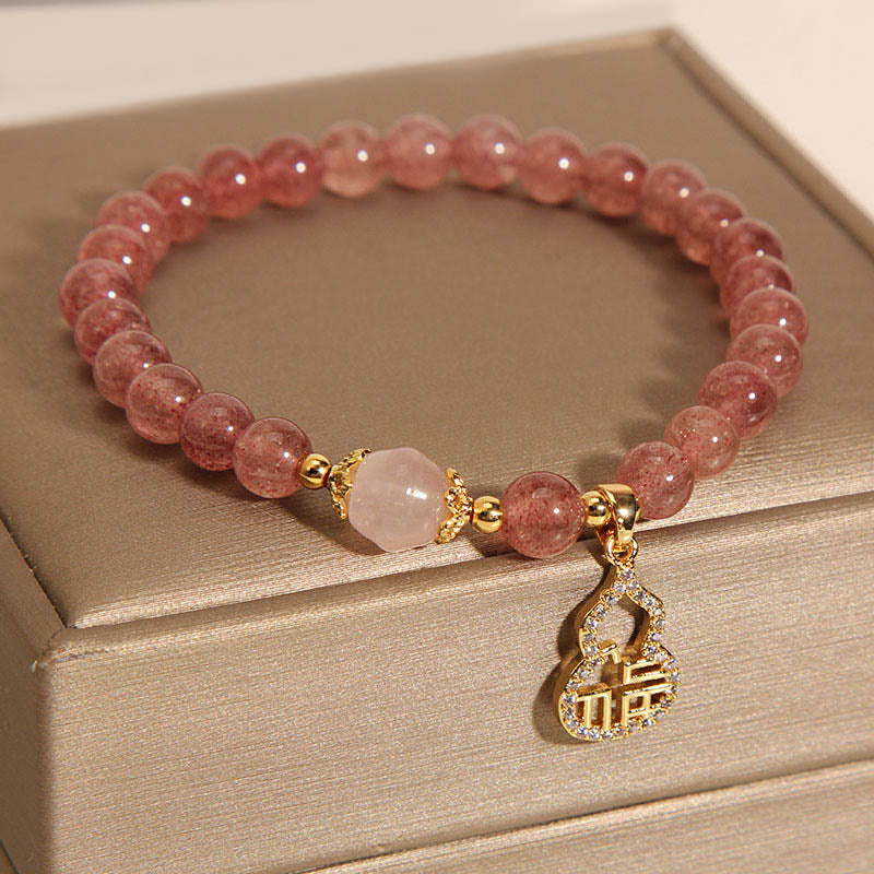 Braccialetto positivo con ciondolo a forma di carattere Fu di zucca e quarzo fragola Buddha Stones