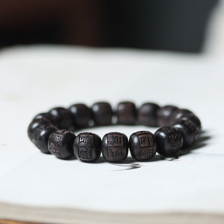 Braccialetto di equilibrio inciso in legno di Buddha Stones tibetano Om Mani Padme Hum