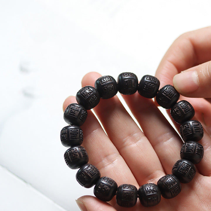 Braccialetto di equilibrio inciso in legno di Buddha Stones tibetano Om Mani Padme Hum