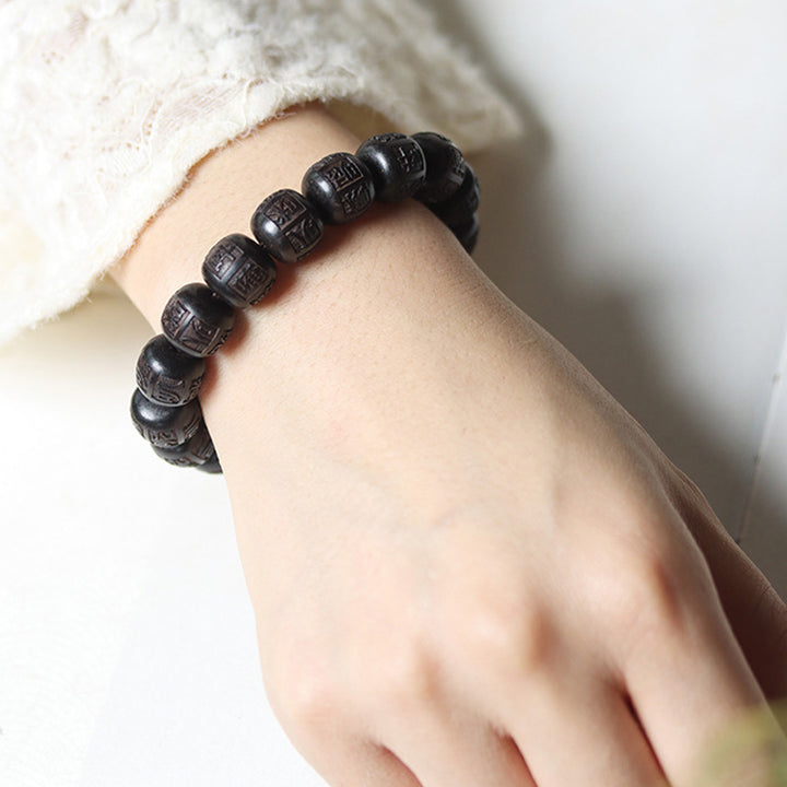 Braccialetto di equilibrio inciso in legno di Buddha Stones tibetano Om Mani Padme Hum