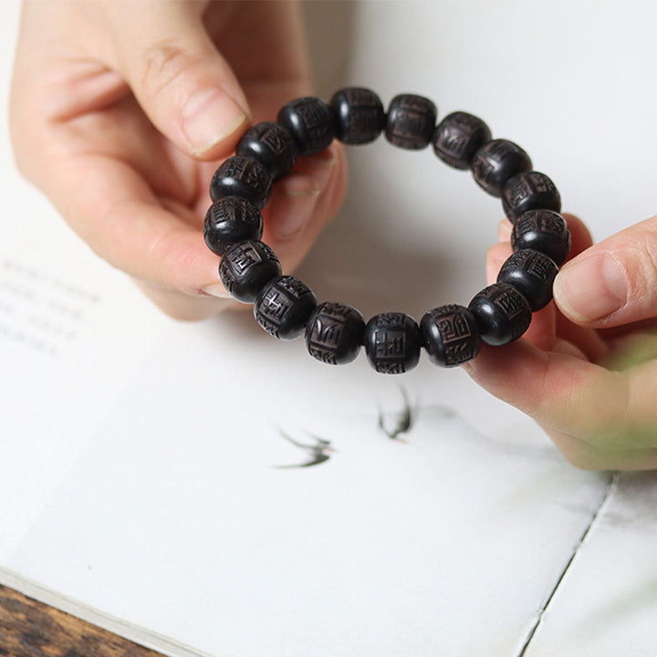 Braccialetto di equilibrio inciso in legno di Buddha Stones tibetano Om Mani Padme Hum
