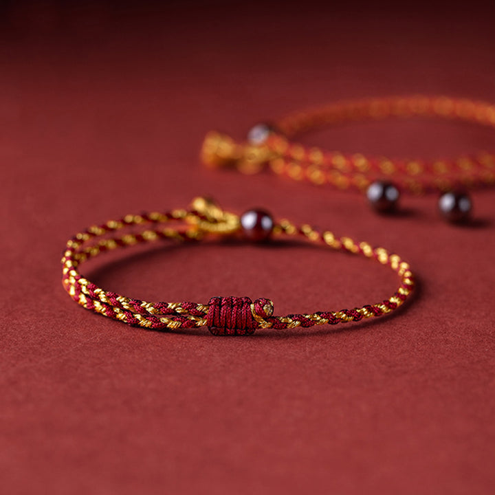 Braccialetto intrecciato con ciondolo di pace e gioia in corda di oro rosso fatto a mano con Buddha Stones
