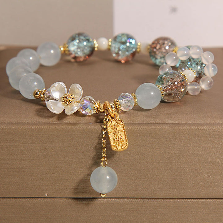 Braccialetto di guarigione naturale con fiore di calcedonio, ametista e cristallo blu Buddha Stones