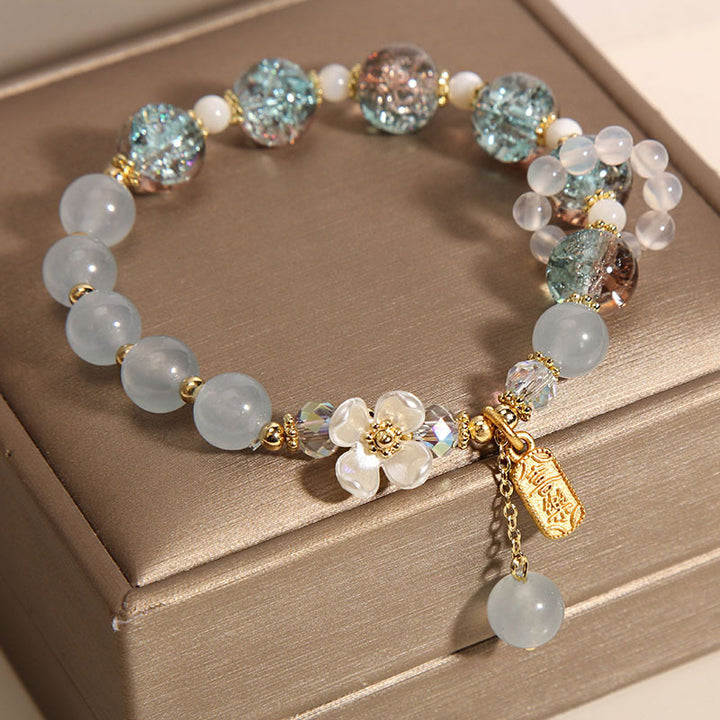Braccialetto di guarigione naturale con fiore di calcedonio, ametista e cristallo blu Buddha Stones