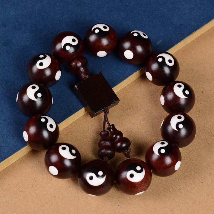 Braccialetto di protezione Yin Yang con piccola foglia di sandalo rosso Buddha Stones