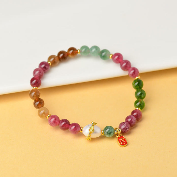 Braccialetto con ciondolo di carattere propizio e saggezza, in perle di tormalina multicolore naturale Buddha Stones