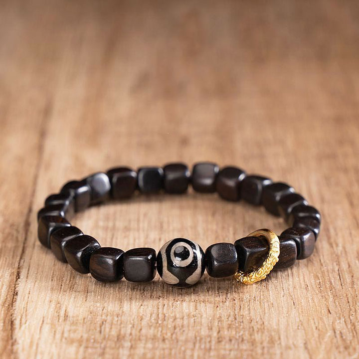 Braccialetto di equilibrio e calma con perline di legno di ebano tibetano Dzi Buddha Stones