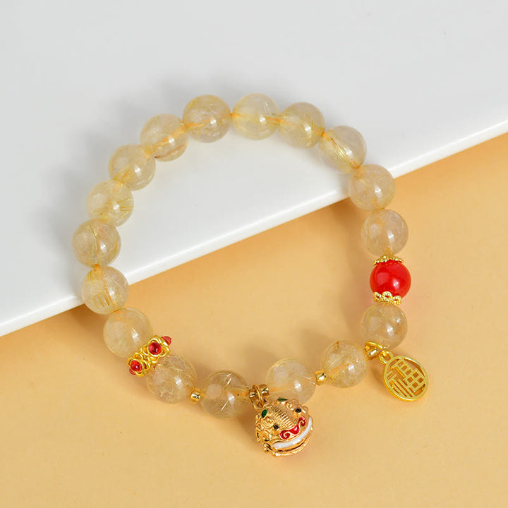 Braccialetto di ricchezza con ciondolo a forma di campana con carattere Fu in quarzo rutilato dorato naturale Buddha Stones
