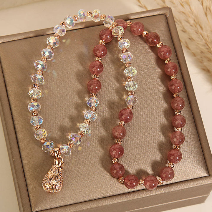 Braccialetto positivo con ciondolo a forma di borsa per soldi in cristallo bianco e quarzo fragola Buddha Stones