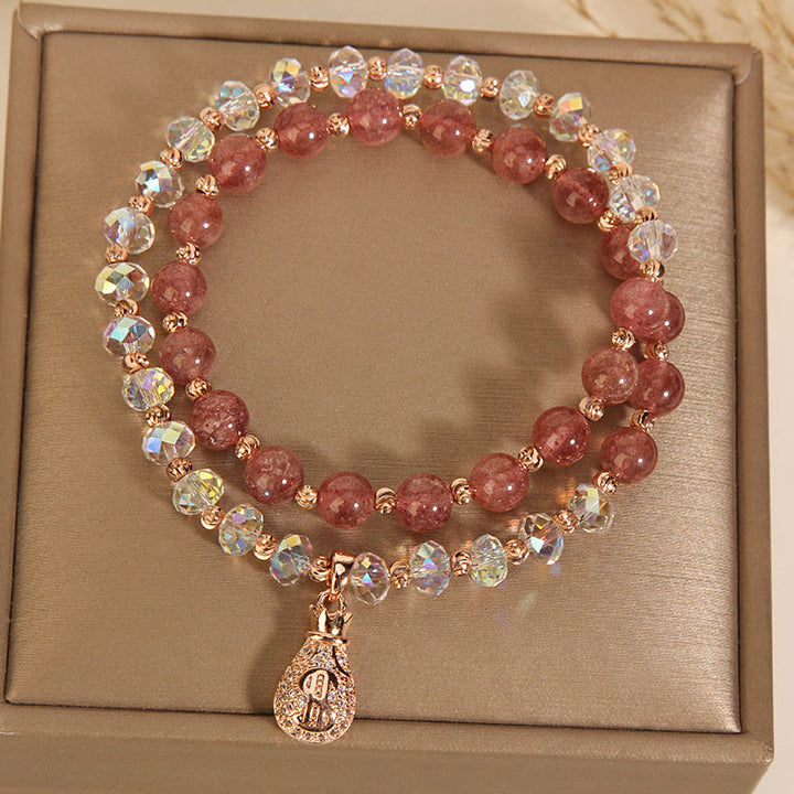 Braccialetto positivo con ciondolo a forma di borsa per soldi in cristallo bianco e quarzo fragola Buddha Stones