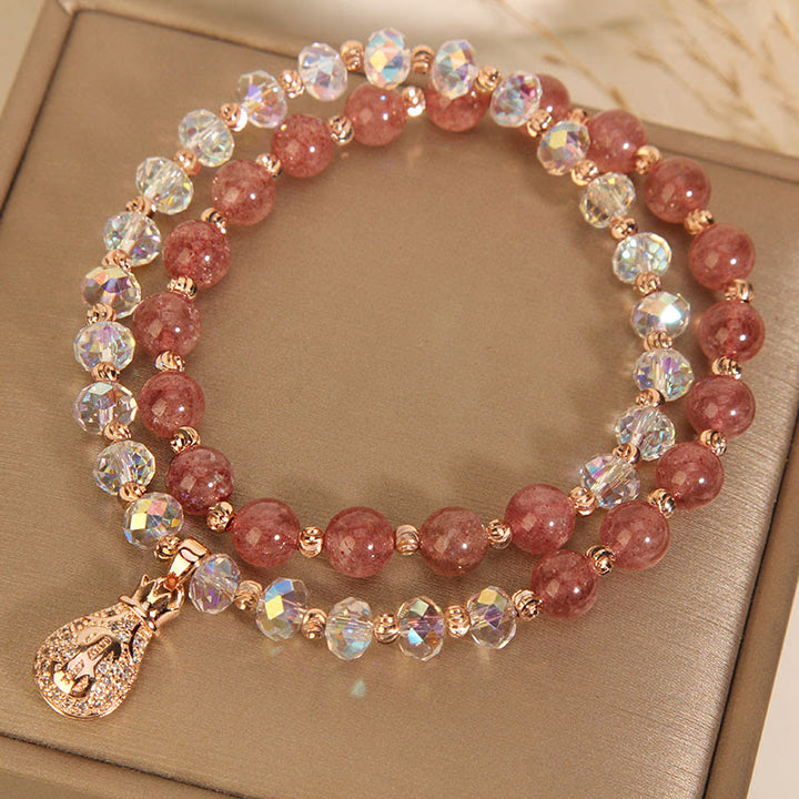 Braccialetto positivo con ciondolo a forma di borsa per soldi in cristallo bianco e quarzo fragola Buddha Stones