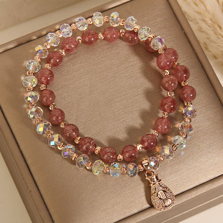 Braccialetto positivo con ciondolo a forma di borsa per soldi in cristallo bianco e quarzo fragola Buddha Stones