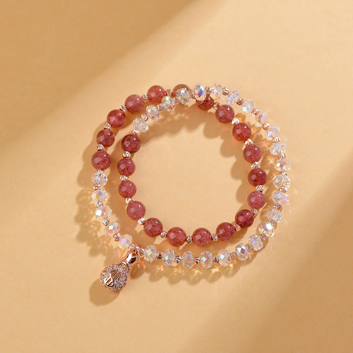 Braccialetto positivo con ciondolo a forma di borsa per soldi in cristallo bianco e quarzo fragola Buddha Stones