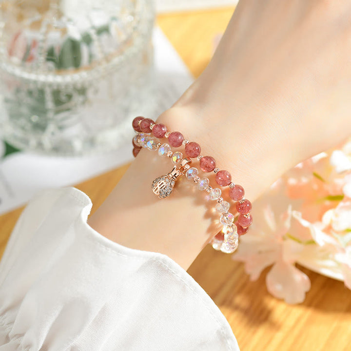 Braccialetto positivo con ciondolo a forma di borsa per soldi in cristallo bianco e quarzo fragola Buddha Stones