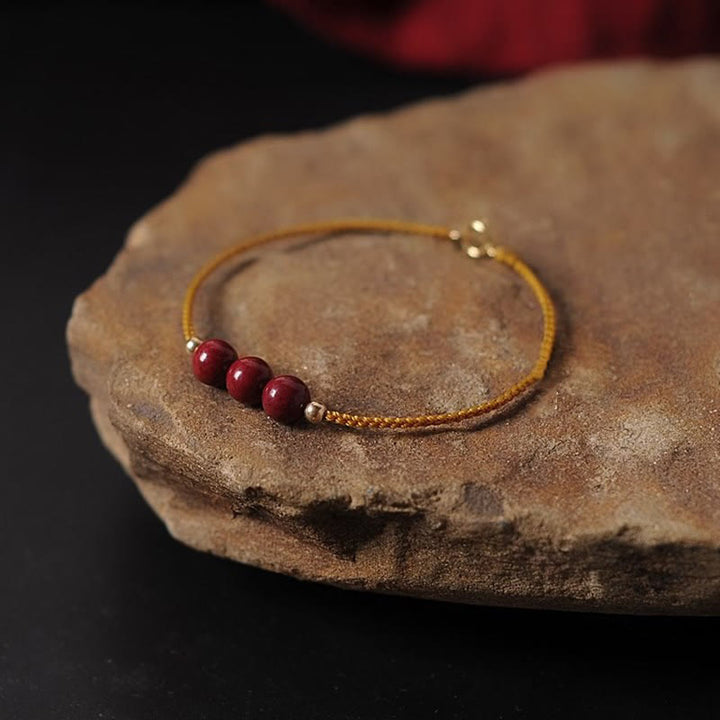 Bracciale intrecciato con corda di benedizione in cinabro naturale placcato oro 14K Buddha Stones