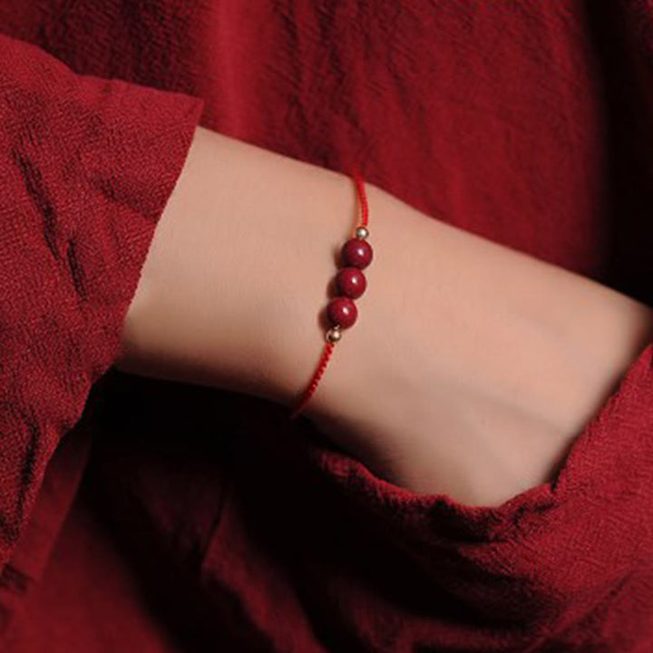 Bracciale intrecciato con corda di benedizione in cinabro naturale placcato oro 14K Buddha Stones