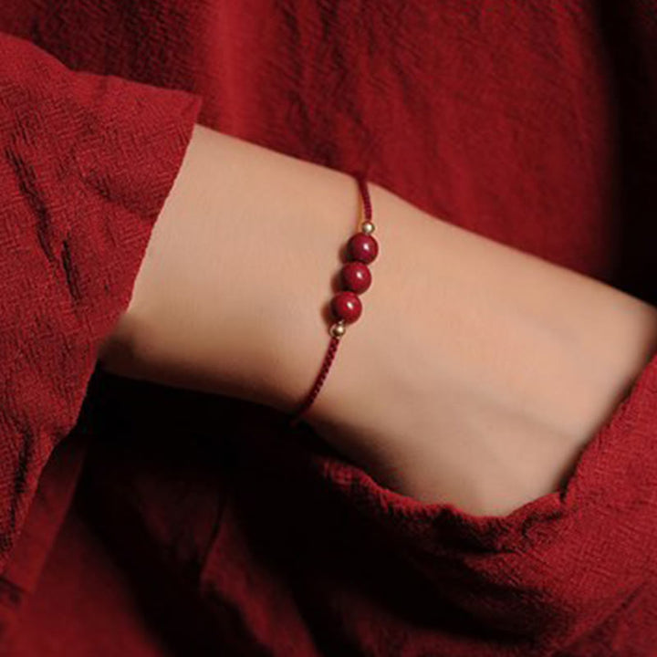 Bracciale intrecciato con corda di benedizione in cinabro naturale placcato oro 14K Buddha Stones