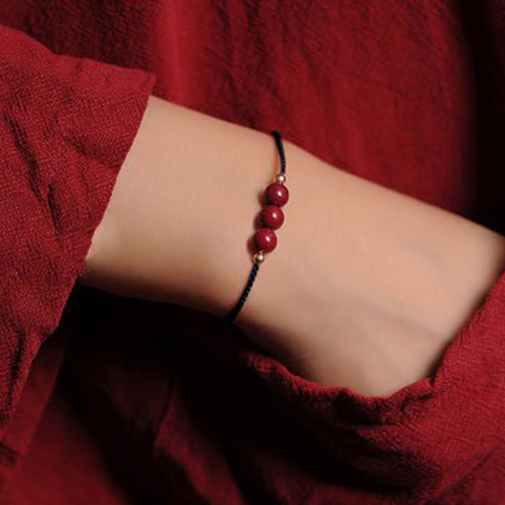 Bracciale intrecciato con corda di benedizione in cinabro naturale placcato oro 14K Buddha Stones