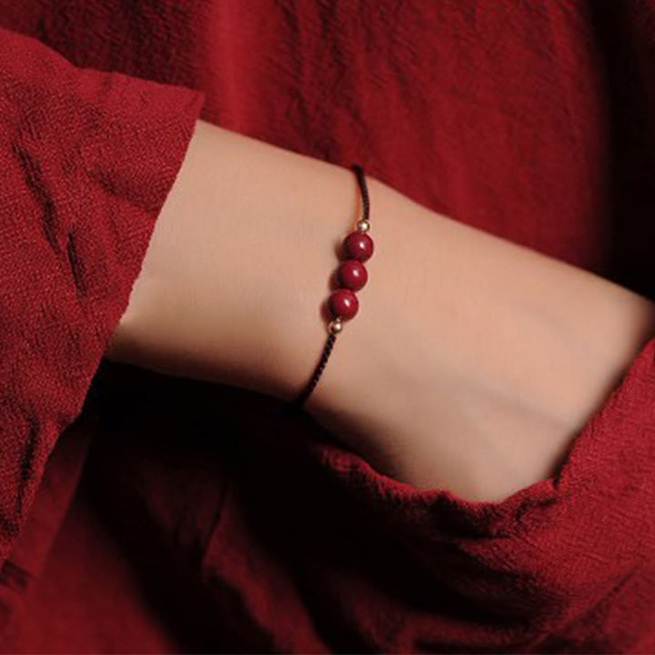 Bracciale intrecciato con corda di benedizione in cinabro naturale placcato oro 14K Buddha Stones