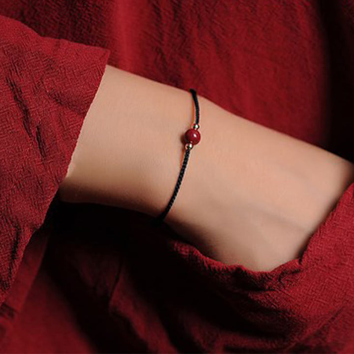 Bracciale intrecciato con corda di benedizione in cinabro naturale placcato oro 14K Buddha Stones