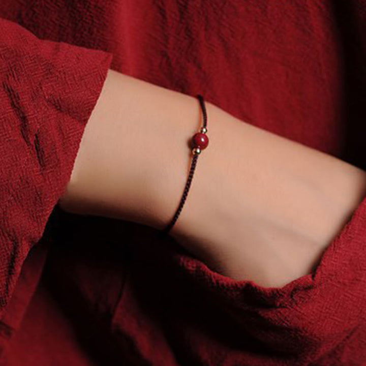 Bracciale intrecciato con corda di benedizione in cinabro naturale placcato oro 14K Buddha Stones