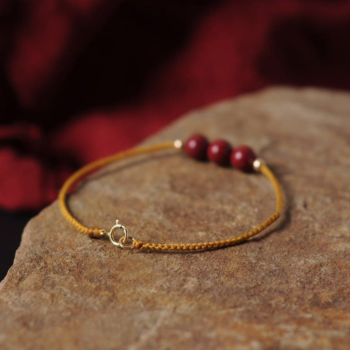 Bracciale intrecciato con corda di benedizione in cinabro naturale placcato oro 14K Buddha Stones