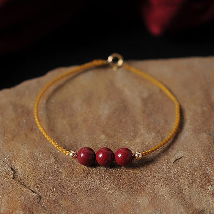Bracciale intrecciato con corda di benedizione in cinabro naturale placcato oro 14K Buddha Stones