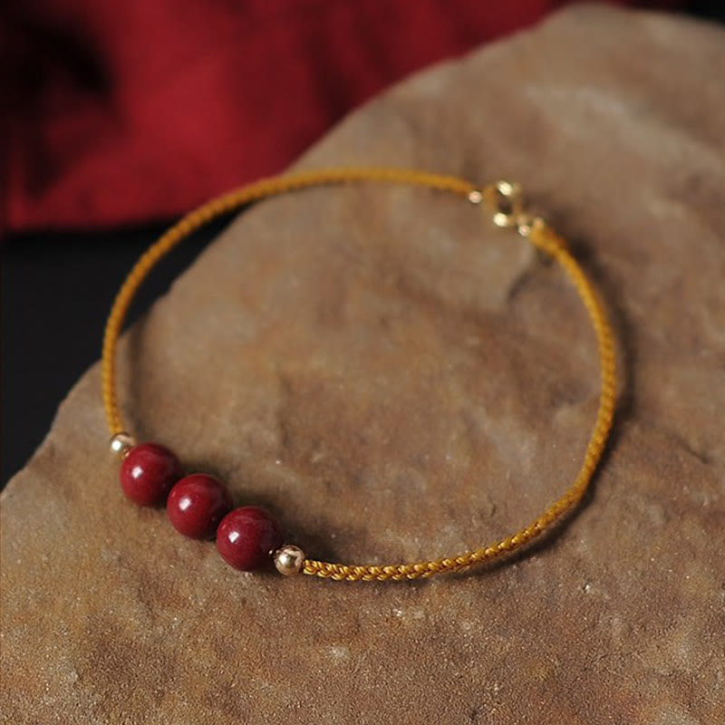 Bracciale intrecciato con corda di benedizione in cinabro naturale placcato oro 14K Buddha Stones