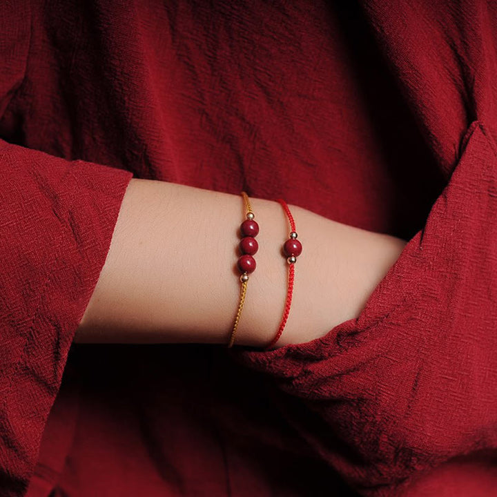 Bracciale intrecciato con corda di benedizione in cinabro naturale placcato oro 14K Buddha Stones