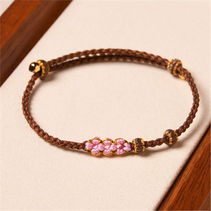 Braccialetto di corda intrecciata con protezione in fiore di pesco fatto a mano Buddha Stones
