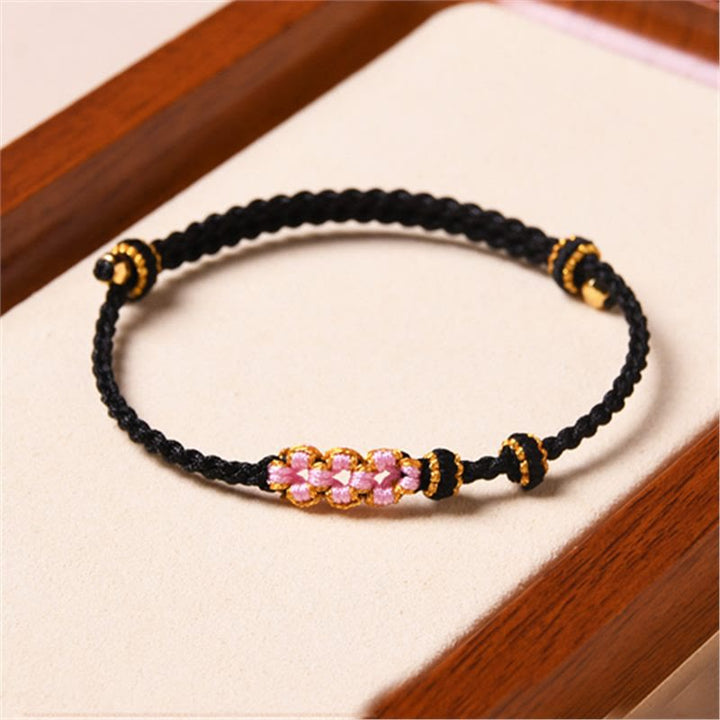 Braccialetto di corda intrecciata con protezione in fiore di pesco fatto a mano Buddha Stones