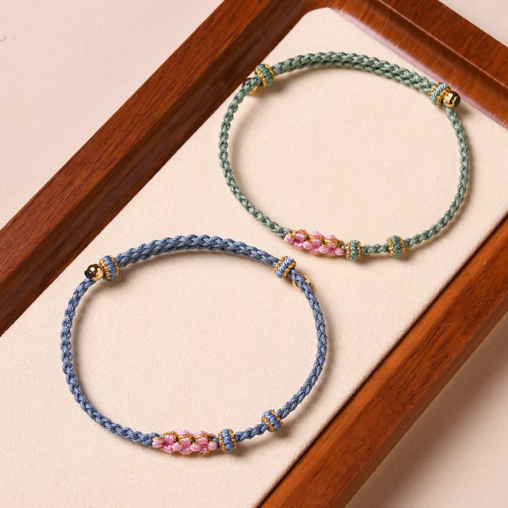 Braccialetto di corda intrecciata con protezione in fiore di pesco fatto a mano Buddha Stones