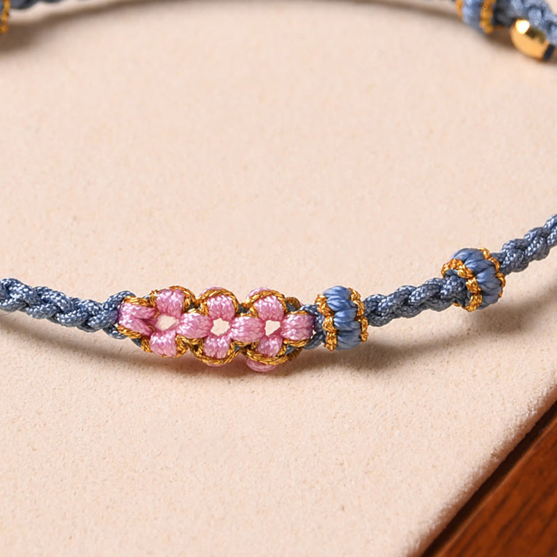 Braccialetto di corda intrecciata con protezione in fiore di pesco fatto a mano Buddha Stones