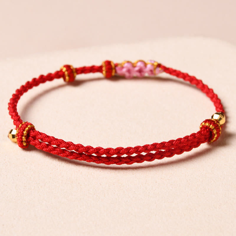 Braccialetto di corda intrecciata con protezione in fiore di pesco fatto a mano Buddha Stones