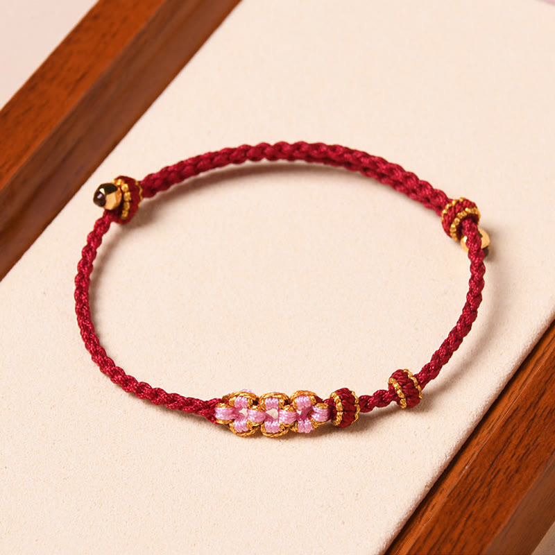 Braccialetto di corda intrecciata con protezione in fiore di pesco fatto a mano Buddha Stones