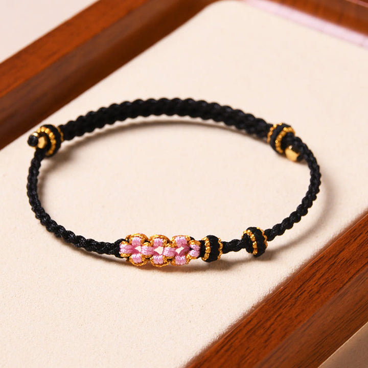 Braccialetto di corda intrecciata con protezione in fiore di pesco fatto a mano Buddha Stones