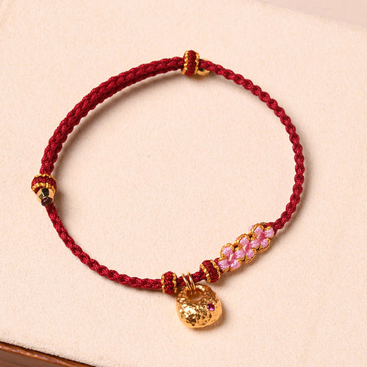 Braccialetto di corda intrecciata con protezione in fiore di pesco fatto a mano Buddha Stones