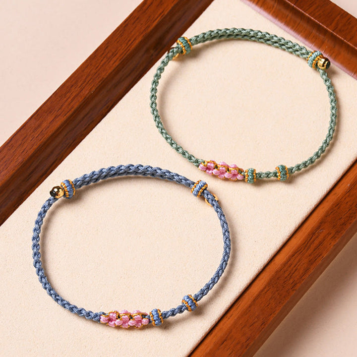 Braccialetto di corda intrecciata con protezione in fiore di pesco fatto a mano Buddha Stones