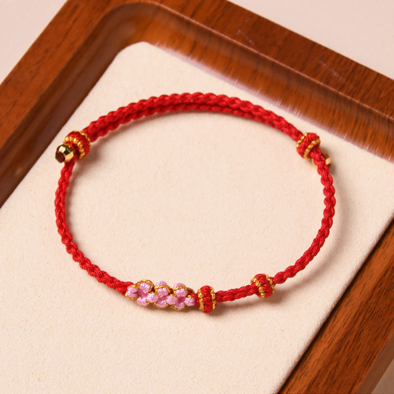 Braccialetto di corda intrecciata con protezione in fiore di pesco fatto a mano Buddha Stones